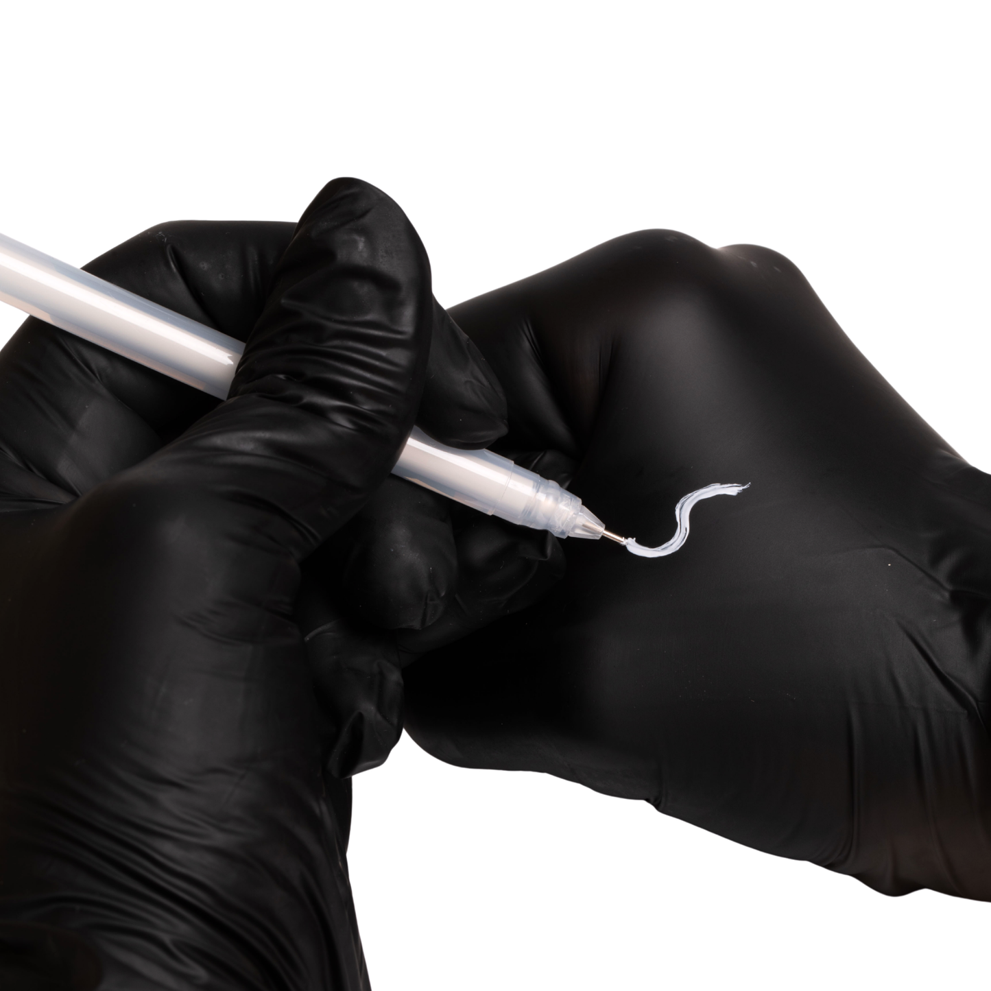 Fine-tip white gel pen creating clean, precise mapping lines on skin for eyebrow symmetry and shaping prep.