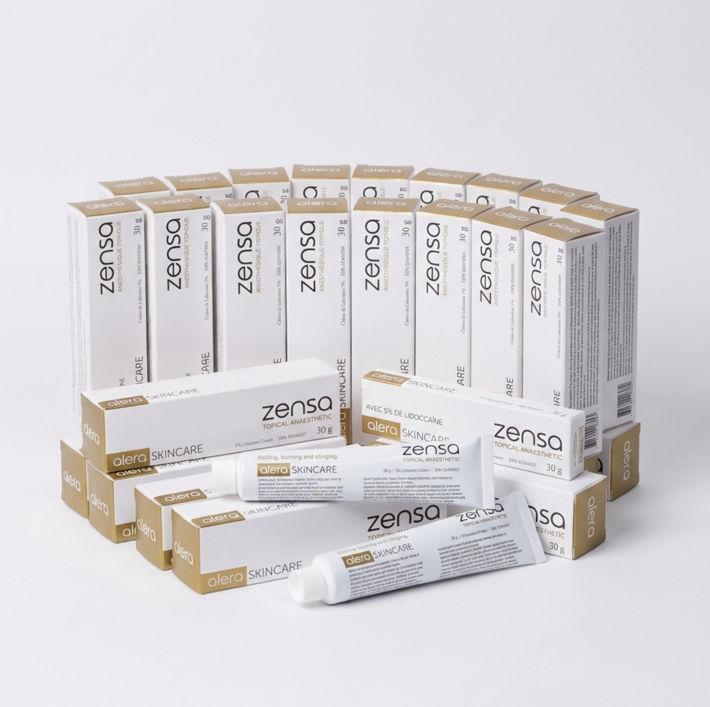 A bulk display of twenty-four 30g tubes of Zensa Pre-Procedure Numbing Cream neatly arranged for professional clinic and training academy use.