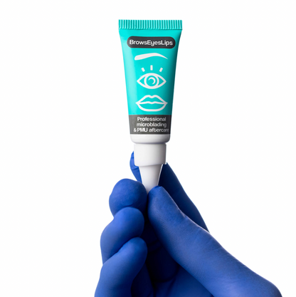 8g tube of BrowsEyesLips PMU and microblading aftercare ointment, formulated with natural ingredients like shea butter and jojoba oil to enhance pigment retention and support skin healing post-procedure.