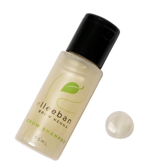 A 55ml bottle of Elleebana Brow Henna Shampoo, a gentle, fragrance-free formula designed to clean skin and eyebrow hair by removing makeup and oils before a henna procedure.