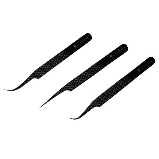 Assortment of three lightweight stainless steel Elleebana professional tweezers, featuring Pro Curve, Straight, and Extra Curve styles, arranged on a clean surface for lash and brow artistry.