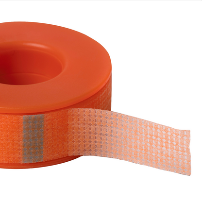 Roll of hypoallergenic 3.6m Elleebana signature orange silicone lash tape, designed for precise tension, layering, and lash insulation during lash lift and extension services.