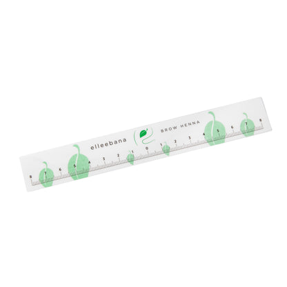 Roll of clear self-adhesive ruler stickers designed for accurate eyebrow mapping and ensuring symmetrical measurements during PMU, microblading, and brow styling procedures.