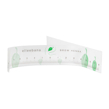 Roll of clear self-adhesive ruler stickers designed for accurate eyebrow mapping and ensuring symmetrical measurements during PMU, microblading, and brow styling procedures.