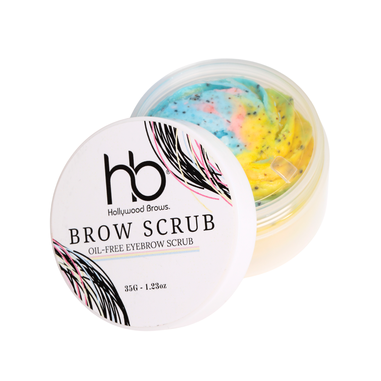 Container of Hollywood Brows oil-free powder-based brow scrub surrounded by fine ground apricot kernel exfoliants on a clean surface.