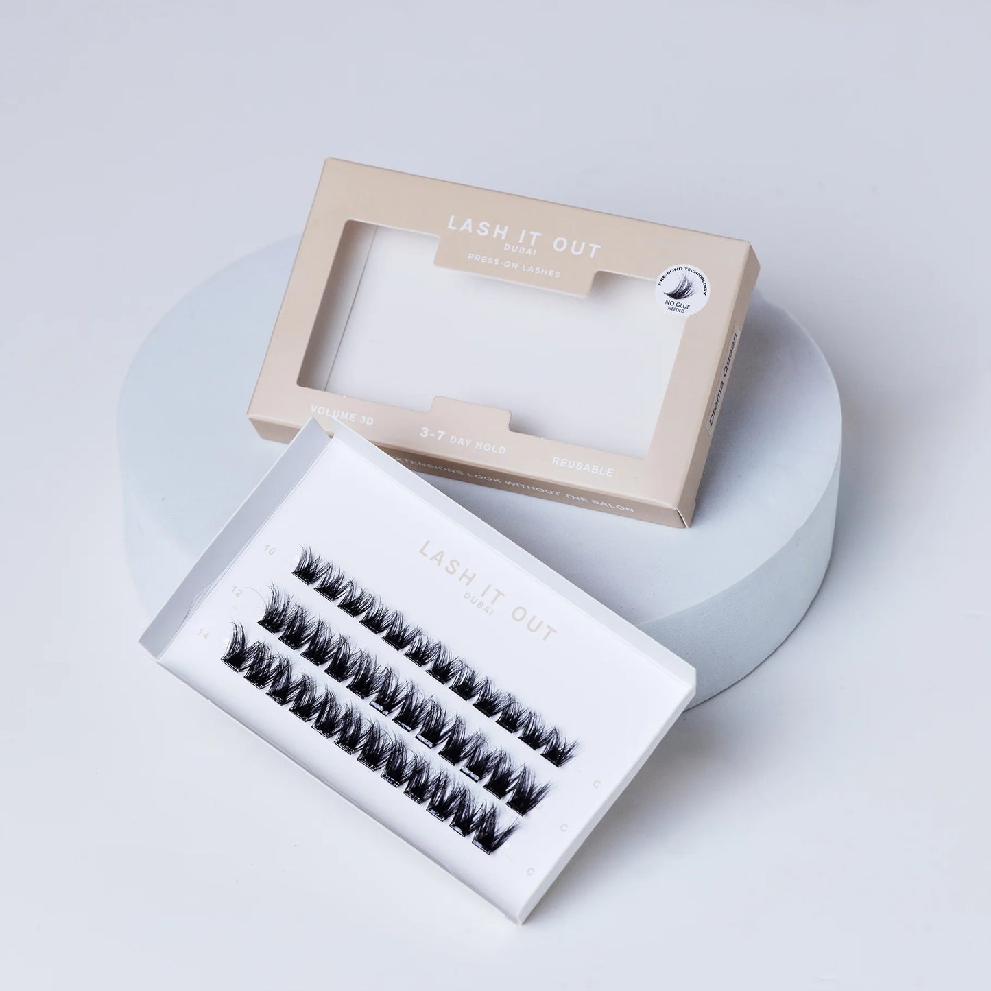 Lash It Out Pre-Glued Under-Lash Extensions Kit featuring 30 pre-glued cluster lashes in 10mm, 12mm, and 14mm lengths with a soft, crisscross design.