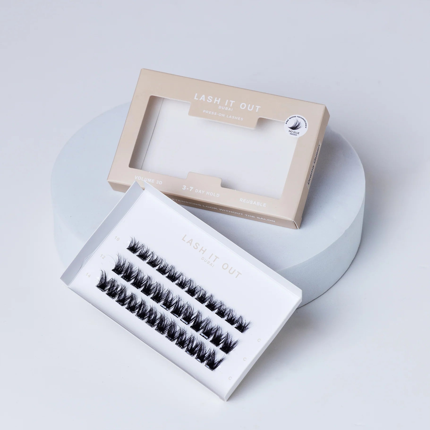 Lash It Out Pre-Glued Under-Lash Extensions Kit featuring 30 pre-glued cluster lashes in 10mm, 12mm, and 14mm lengths with a soft, crisscross design.