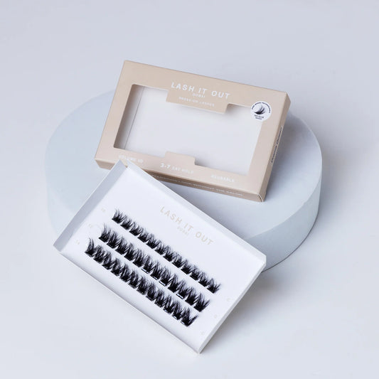 Lash It Out Pre-Glued Under-Lash Extensions Kit featuring 30 pre-glued cluster lashes in 10mm, 12mm, and 14mm lengths with a soft, crisscross design.