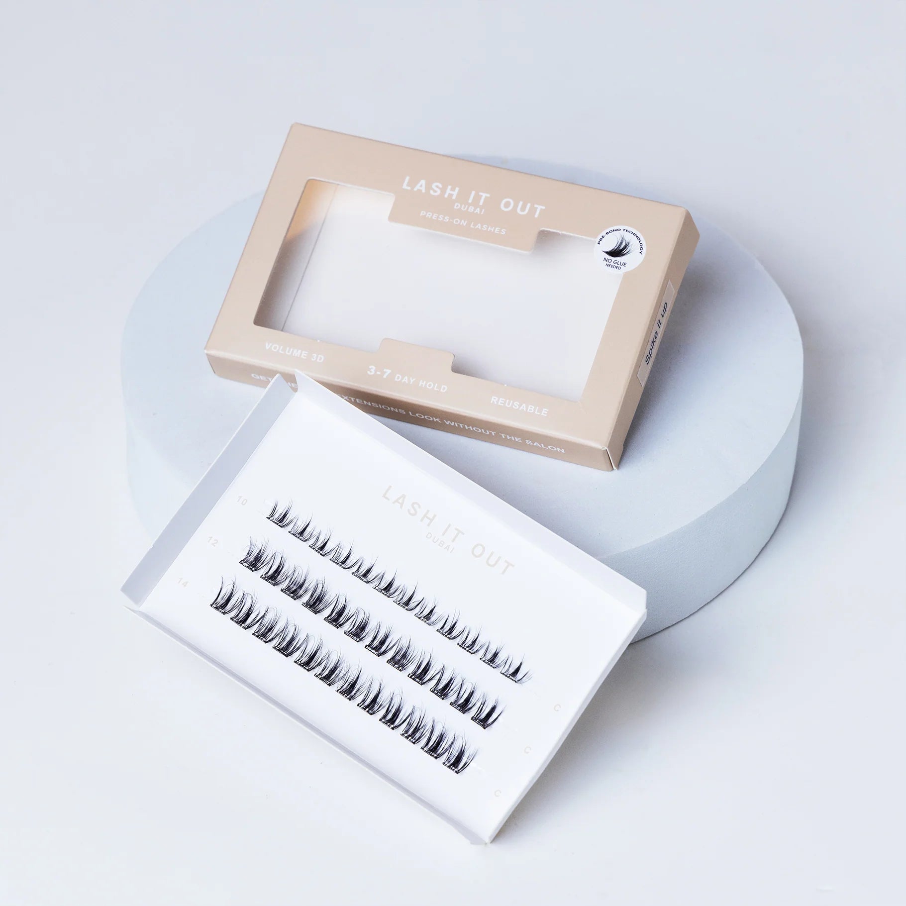 Lash It Out Pre-Glued Under-Lash Extensions Kit featuring 30 pre-glued cluster lashes in 10mm, 12mm, and 14mm lengths with a soft, crisscross design.