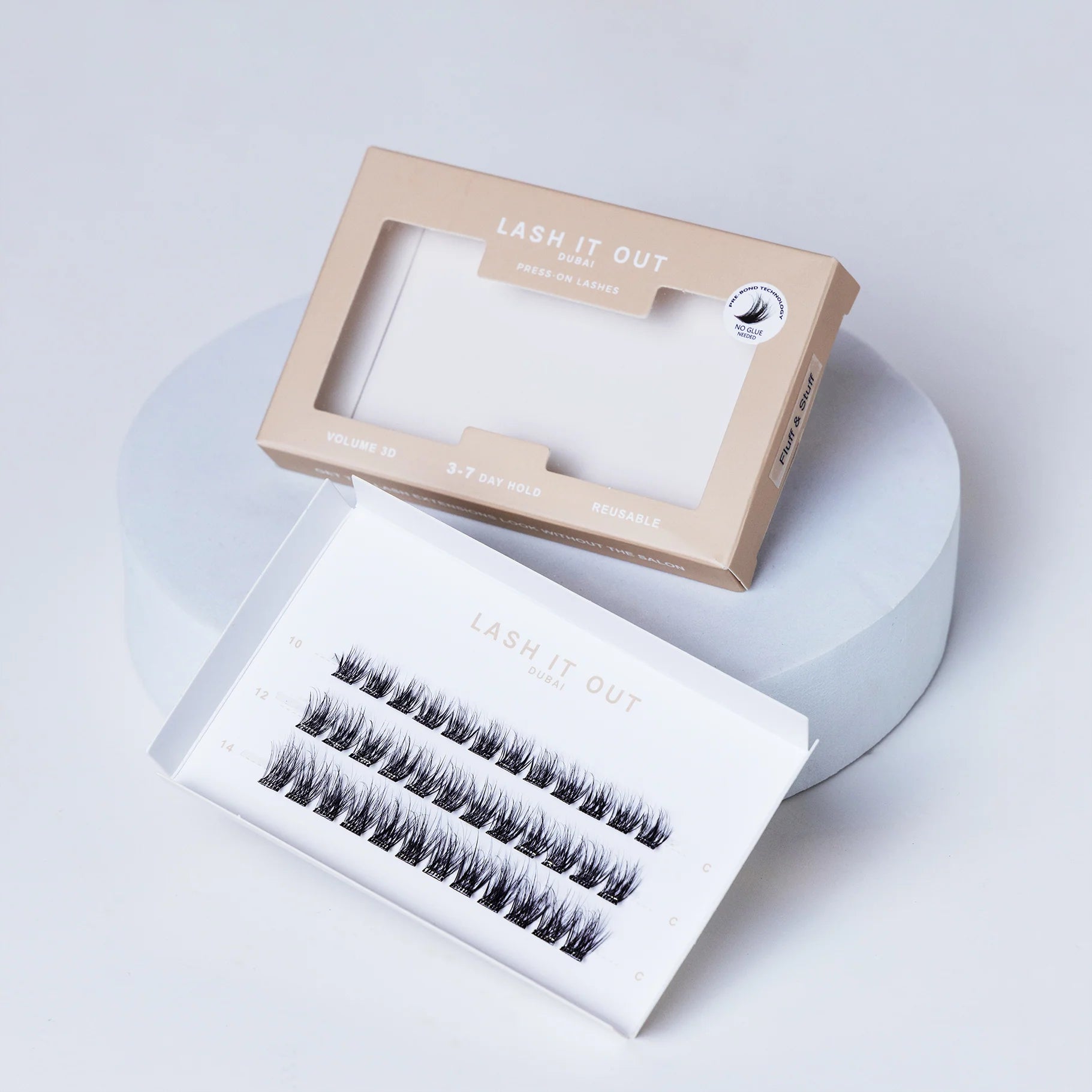 Lash It Out Pre-Glued Under-Lash Extensions Kit featuring 30 pre-glued cluster lashes in 10mm, 12mm, and 14mm lengths with a soft, crisscross design.