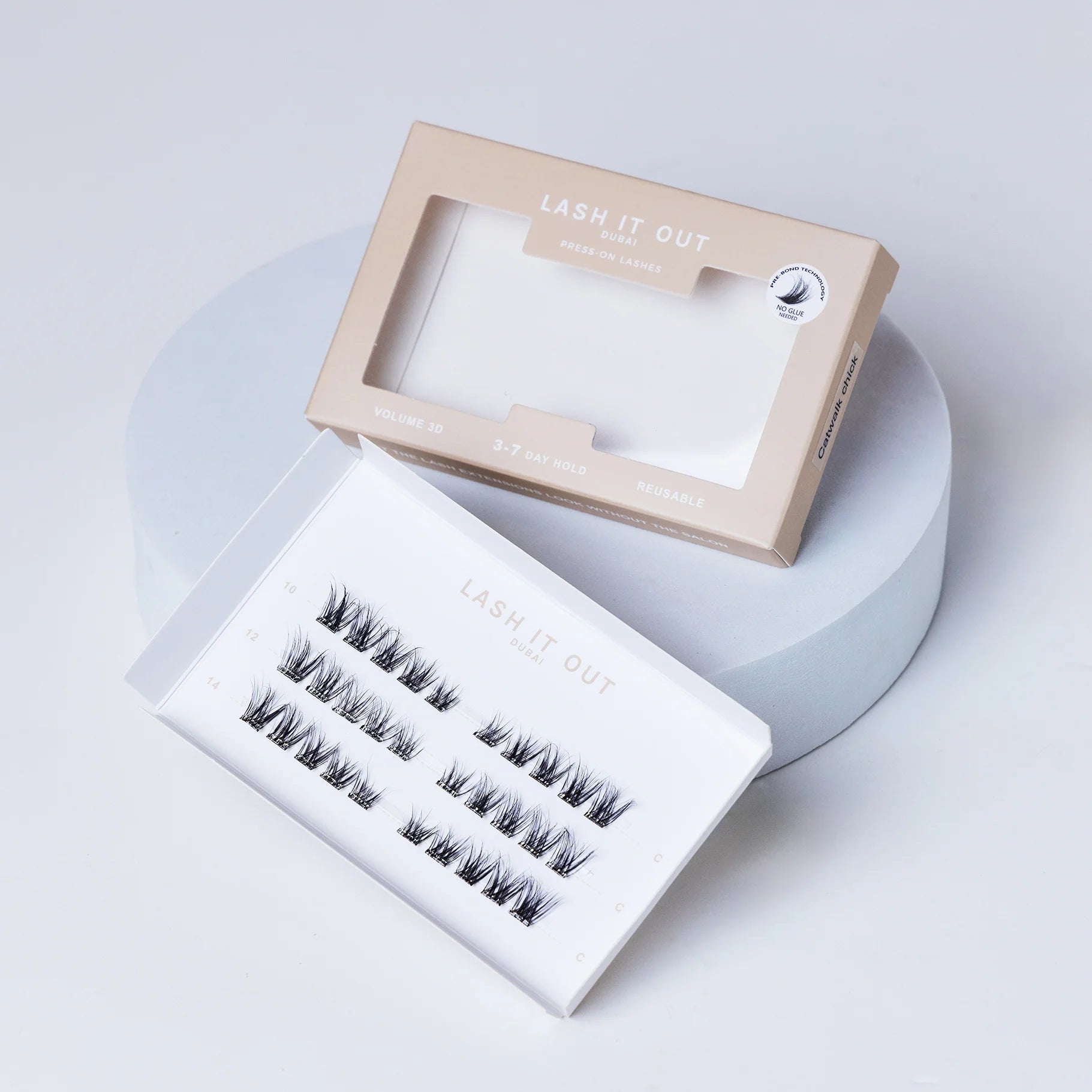 Lash It Out Pre-Glued Under-Lash Extensions Kit featuring 30 pre-glued cluster lashes in 10mm, 12mm, and 14mm lengths with a soft, crisscross design.