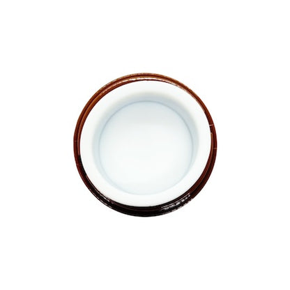 Compact white electric wax heater with a removable metal pot and lid, set on a plain studio background.