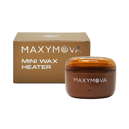 Compact white electric wax heater with a removable metal pot and lid, set on a plain studio background.