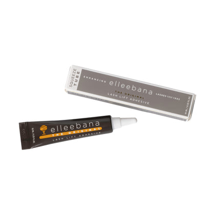 Flexible 10ml squeeze tube of clear original Elleebana lash lift adhesive with black cap on a plain studio background.