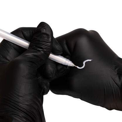 Fine-tip white gel pen creating clean, precise mapping lines on skin for eyebrow symmetry and shaping prep.