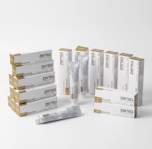 A bulk display of twenty-four 30g tubes of Zensa Pre-Procedure Numbing Cream neatly arranged for professional clinic and training academy use.