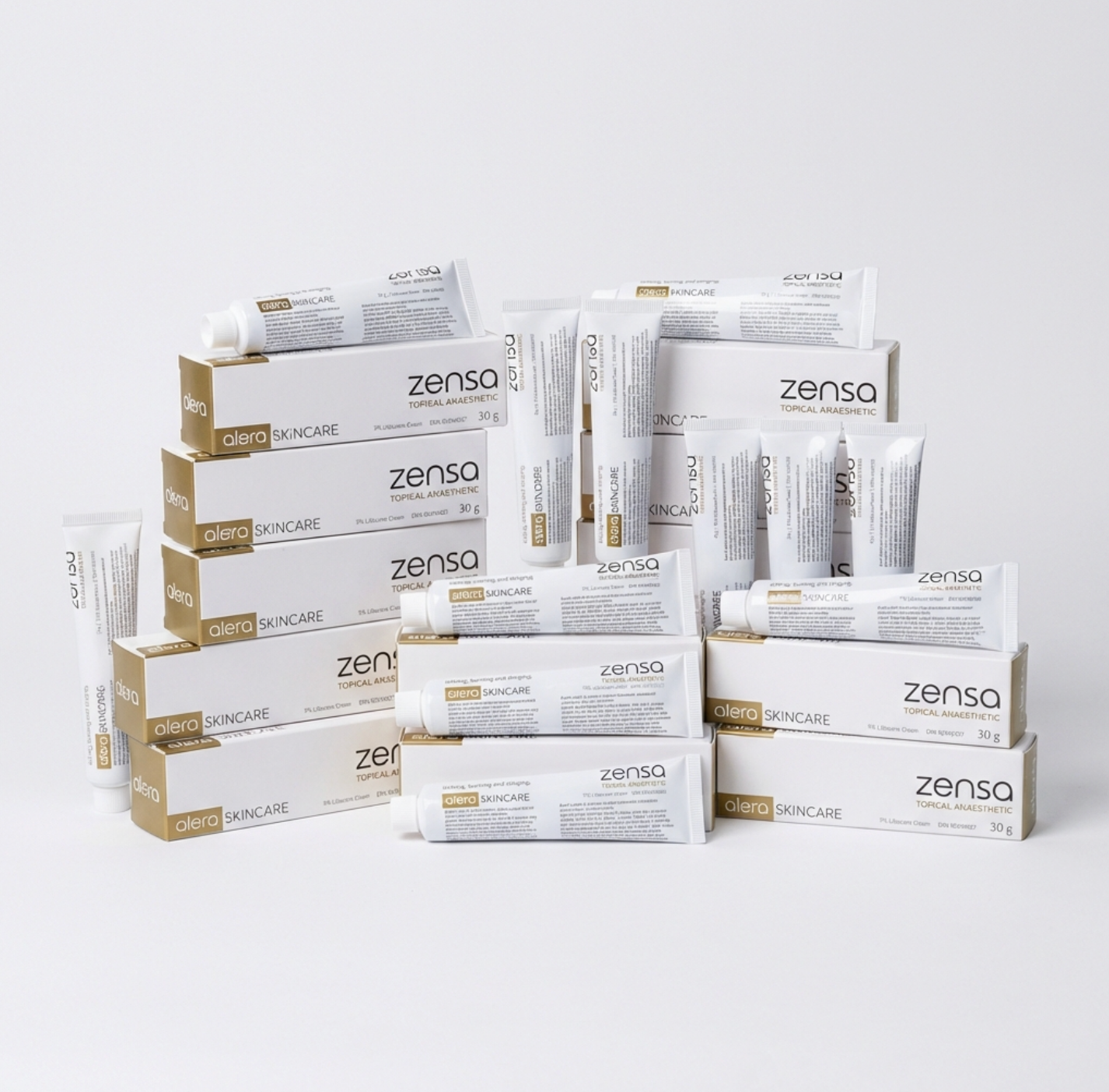 A bulk display of twenty-four 30g tubes of Zensa Pre-Procedure Numbing Cream neatly arranged for professional clinic and training academy use.