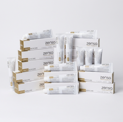 A bulk display of twenty-four 30g tubes of Zensa Pre-Procedure Numbing Cream neatly arranged for professional clinic and training academy use.