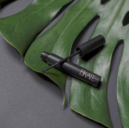 B'KATE brow gel tube next to its packaging box, featuring a fine spoolie brush designed to groom and set eyebrow hairs with a vitamin B5-enriched clear formula.