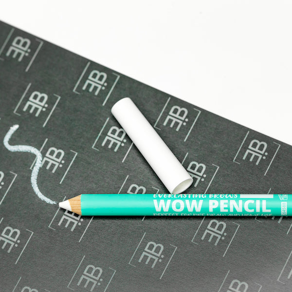  A white single-use Everlasting predraw brow pencil shown on a dark background displaying crisp white swatch marks for eyebrow mapping.