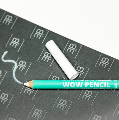  A white single-use Everlasting predraw brow pencil shown on a dark background displaying crisp white swatch marks for eyebrow mapping.