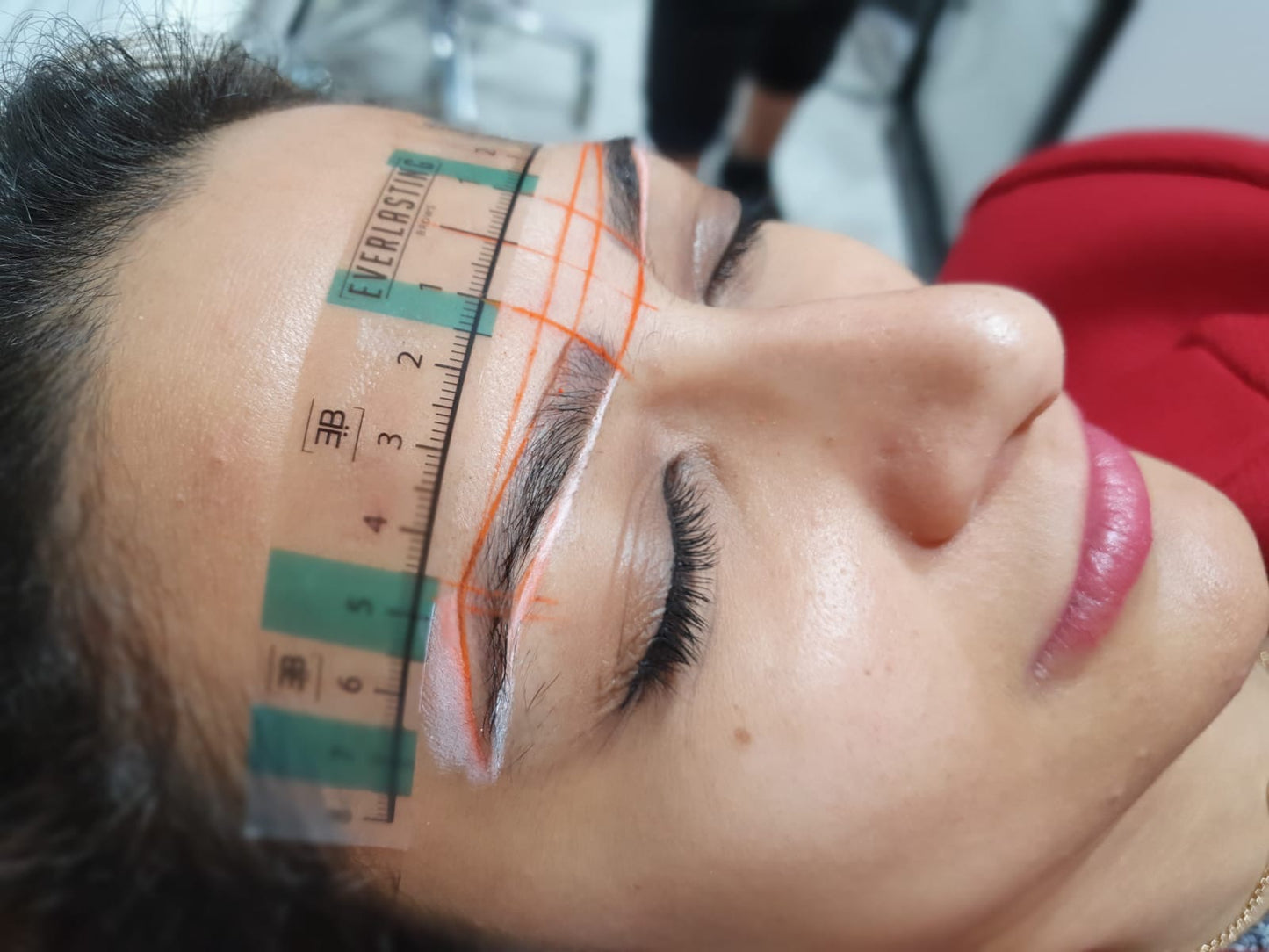 High-definition close-up result of permanent eyebrow microblading and combination ombre shading performed on a client.