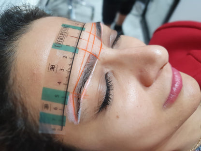 High-definition close-up result of permanent eyebrow microblading and combination ombre shading performed on a client.