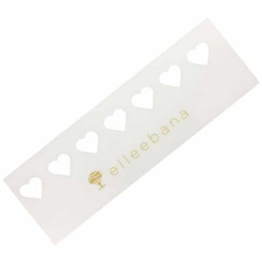 Heart-shaped adhesive skin stencils designed for displaying client tint colour swatches and performing decorative tint patch testing in beauty salons.