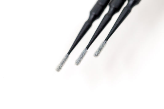 Black disposable microbrush applicators with lint-free fine tips for lash extension priming and PMU product application.