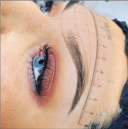 A promotional graphic for the Everlasting Brow Mapping online course, displaying training materials including HD video tutorials, a 20-page workbook, and a certificate of completion for professional eyebrow shaping.

